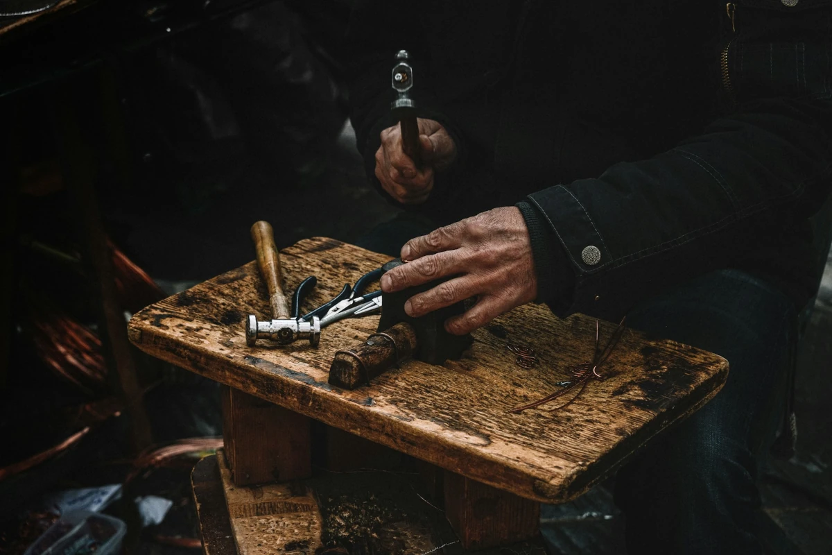 picture of a guy working with hammer